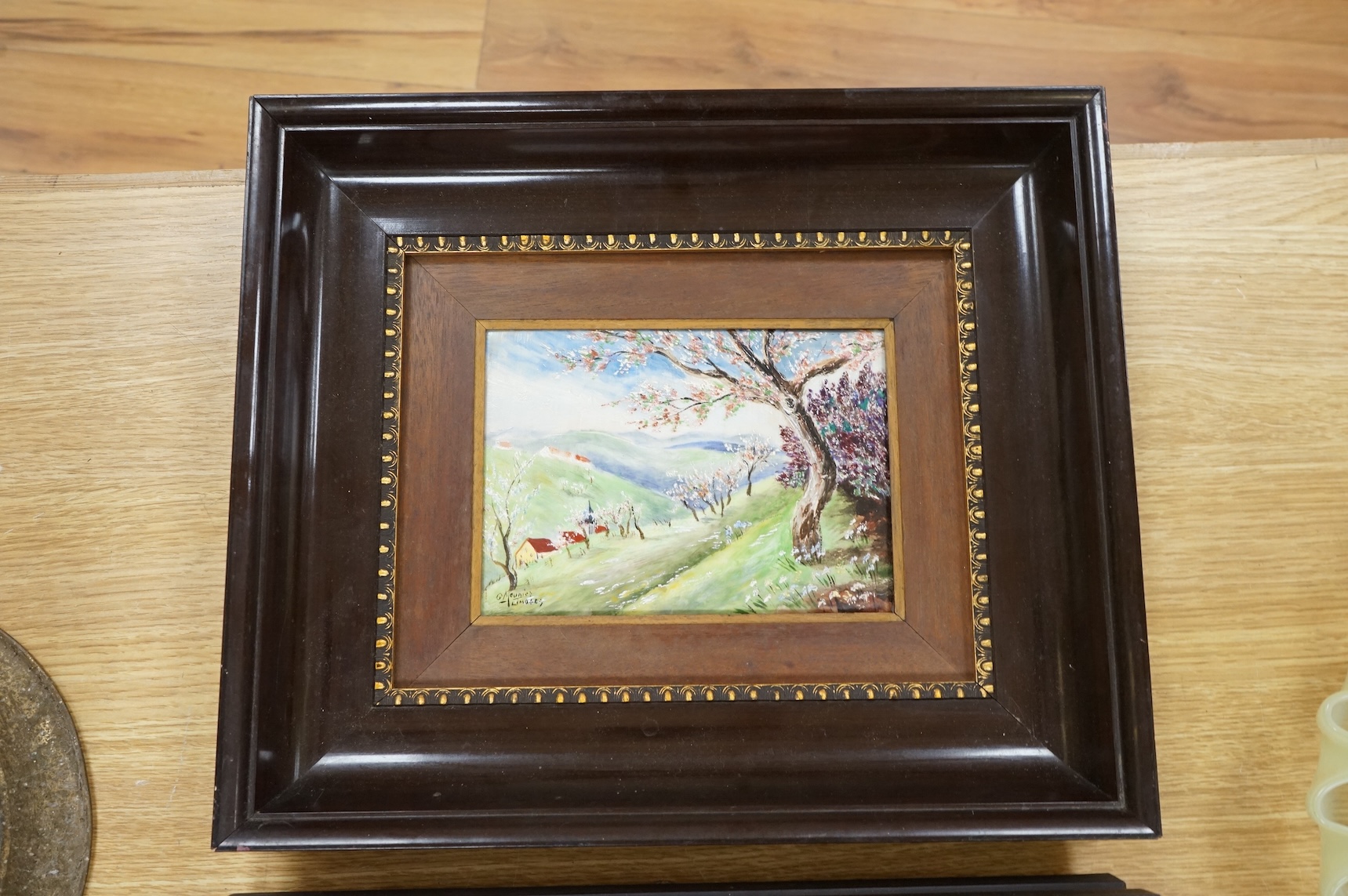 A pair of Limoges porcelain plaques depicting landscapes, signed G Meunier, framed, 30 x 35cm
